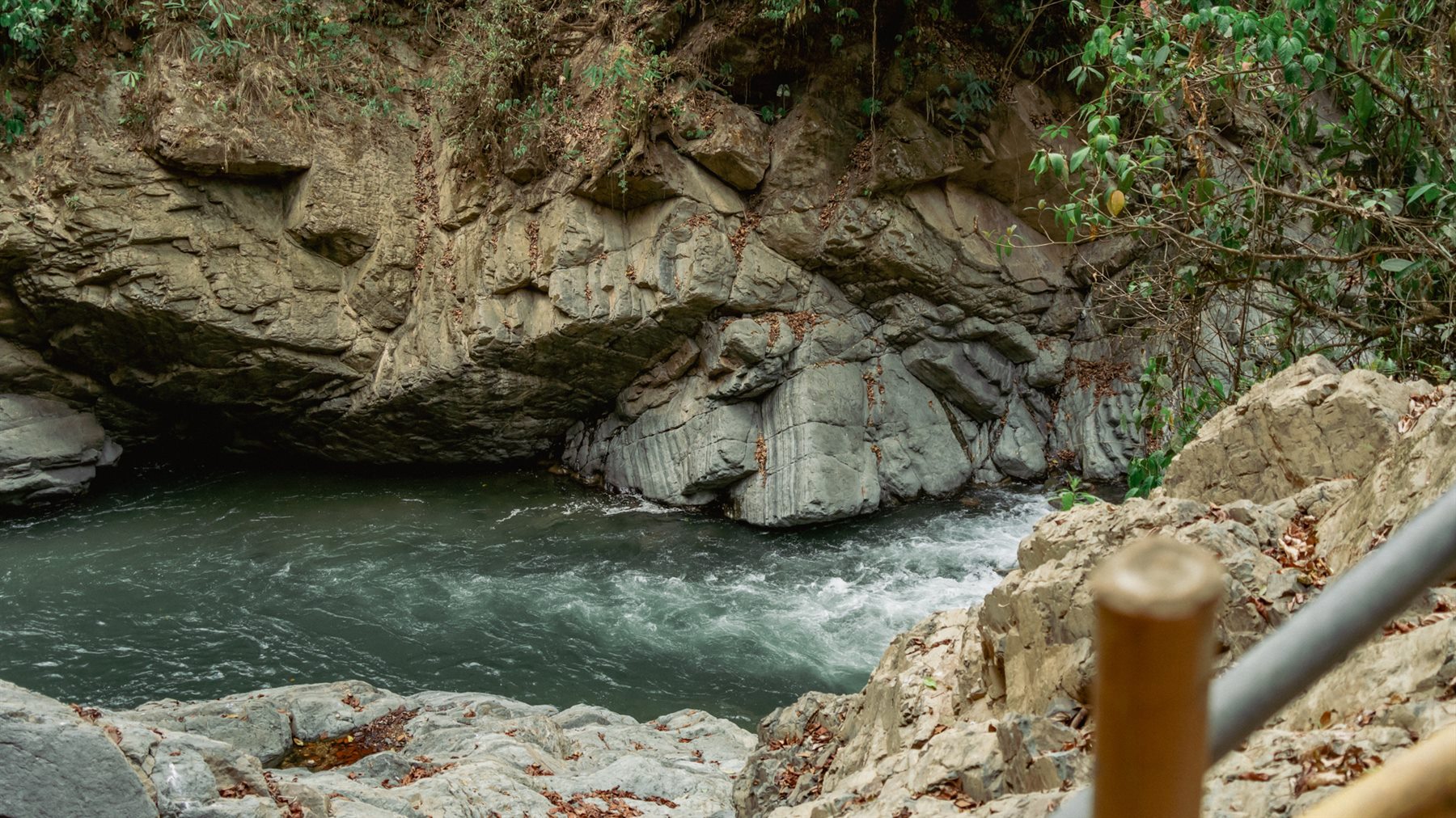Naranjo River flowing through a forested canyon